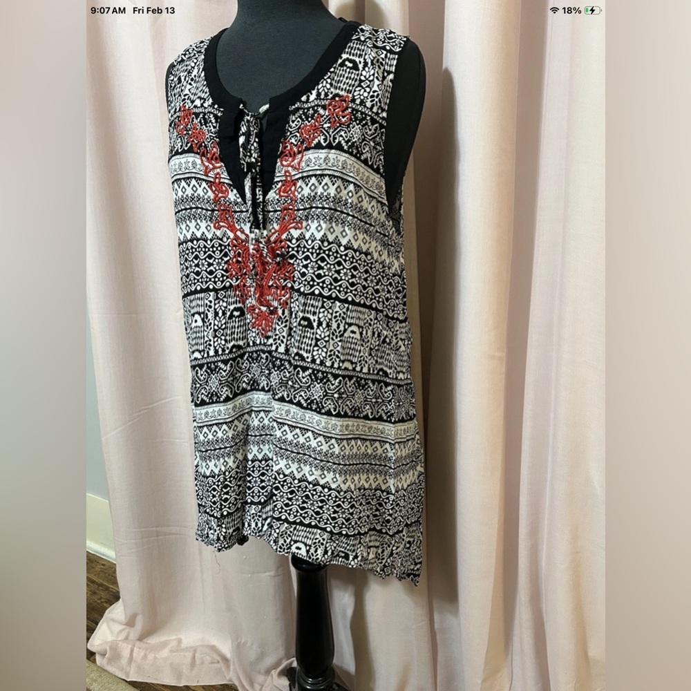 Elegant Black and White Patterned Blouse with Red Details